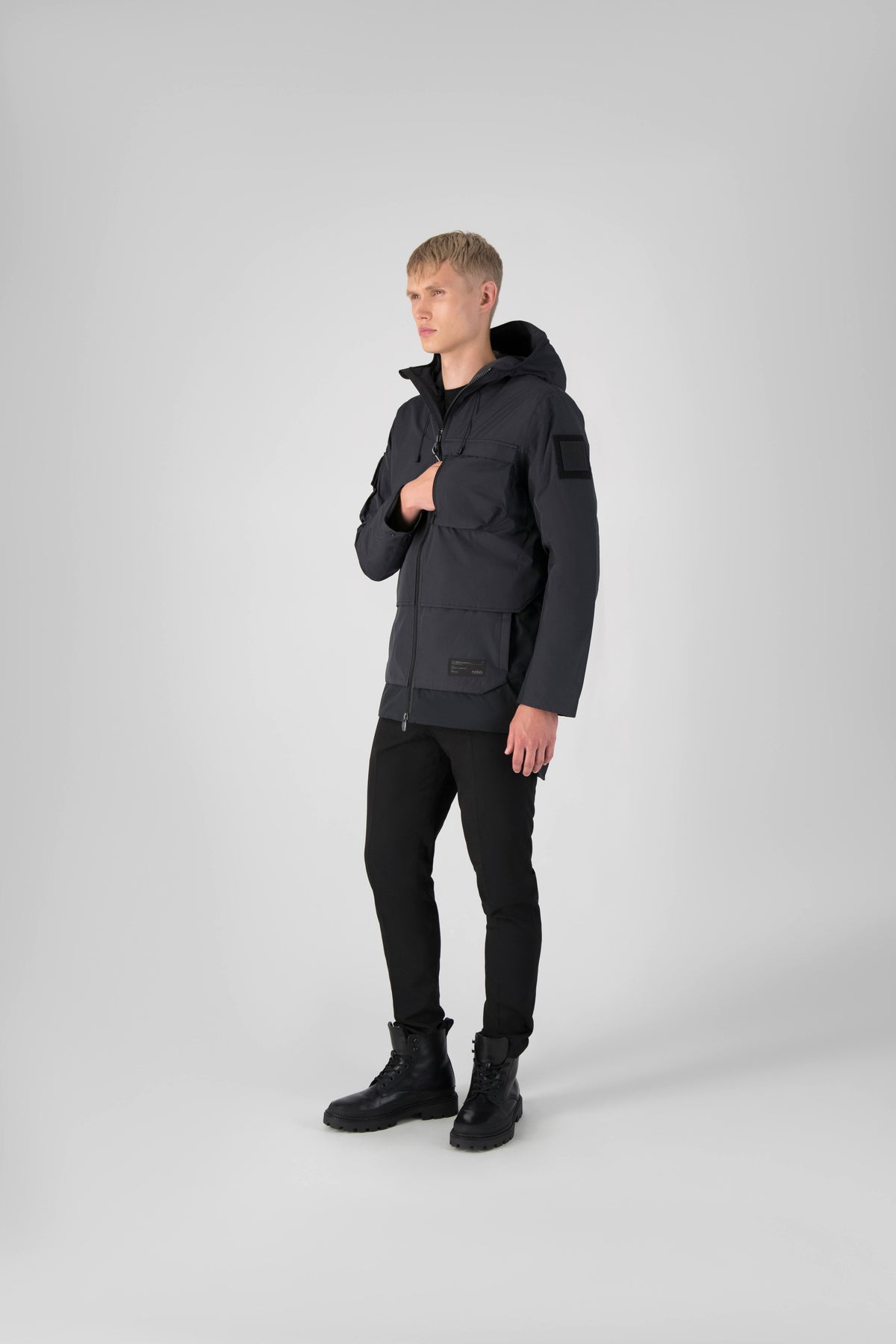 Alta Men's Performance Shell Jacket in hip length, Primaloft Gold Insulation Active+, chest and waist pockets, ventilation under arms, reflective detailing on hood and back, two-way front zipper, and non-removable hood with adjustable drawstrings, in Black
