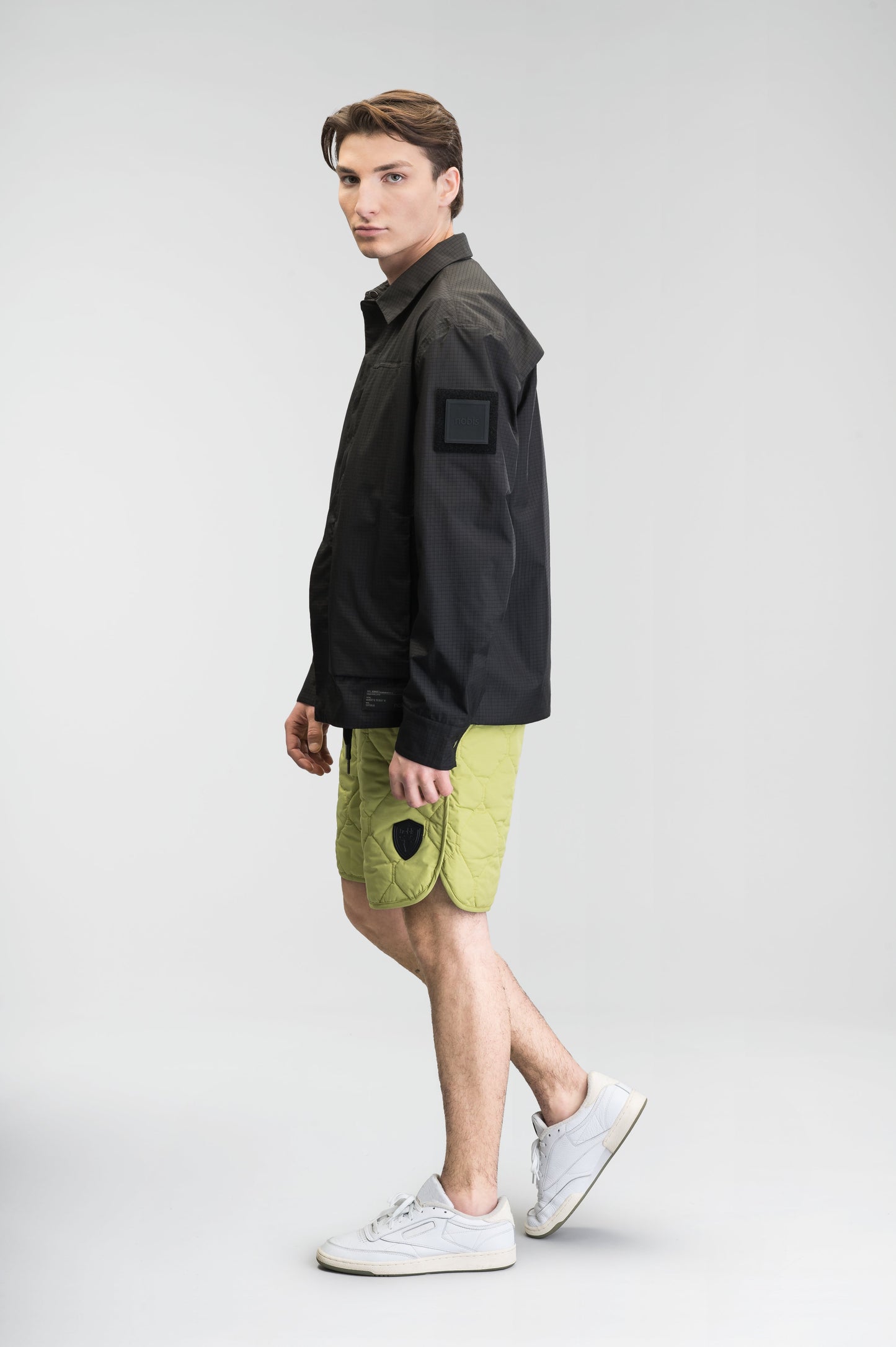 Curt Men's Performance Quilted Shorts at knee length, premium stretch nylon and stretch ripstop fabricaiton, premium 4-way stretch, water resistant Primaloft Gold Insulation Active+, side seam pockets, exteriror back pocket, elasticized waist with drawcords, and notch detailing at side seams, in Dark Citron