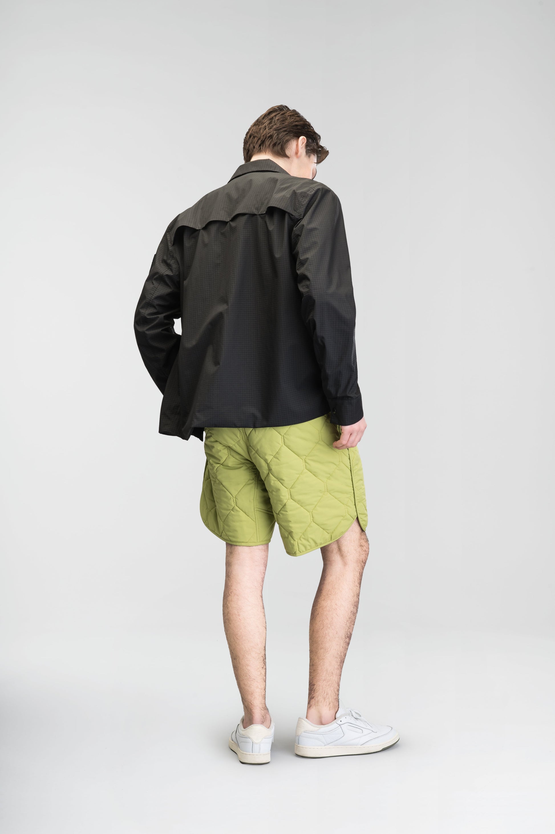 Curt Men's Performance Quilted Shorts at knee length, premium stretch nylon and stretch ripstop fabricaiton, premium 4-way stretch, water resistant Primaloft Gold Insulation Active+, side seam pockets, exteriror back pocket, elasticized waist with drawcords, and notch detailing at side seams, in Dark Citron