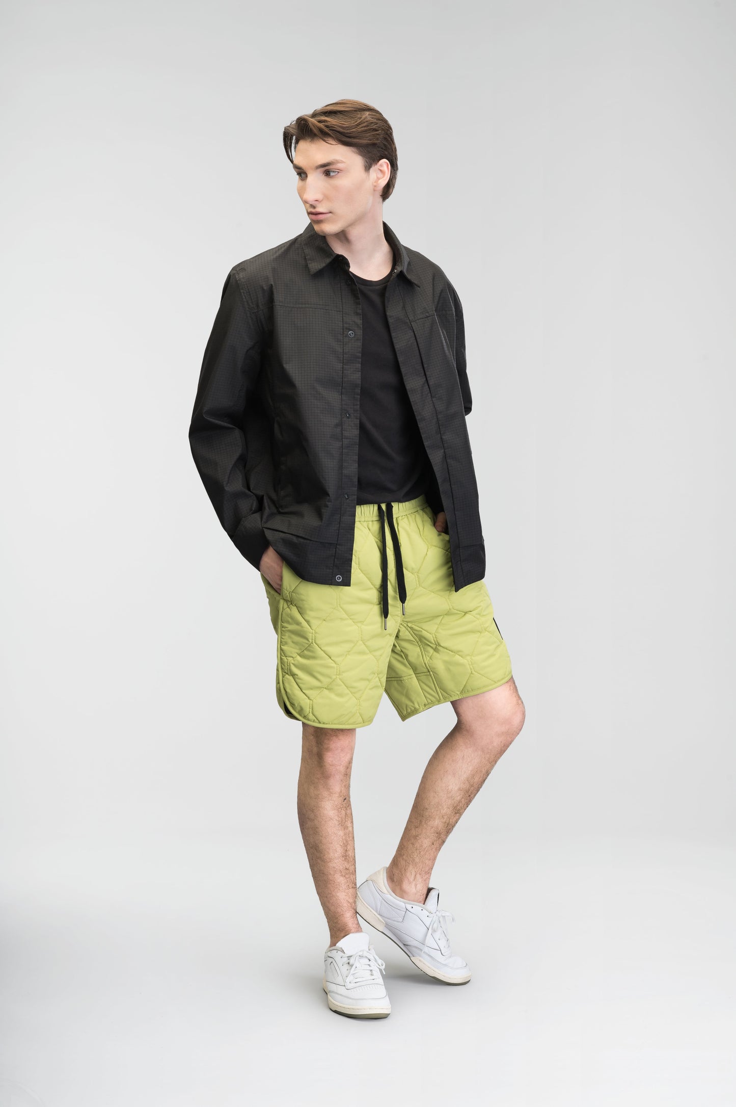 Curt Men's Performance Quilted Shorts at knee length, premium stretch nylon and stretch ripstop fabricaiton, premium 4-way stretch, water resistant Primaloft Gold Insulation Active+, side seam pockets, exteriror back pocket, elasticized waist with drawcords, and notch detailing at side seams, in Dark Citron