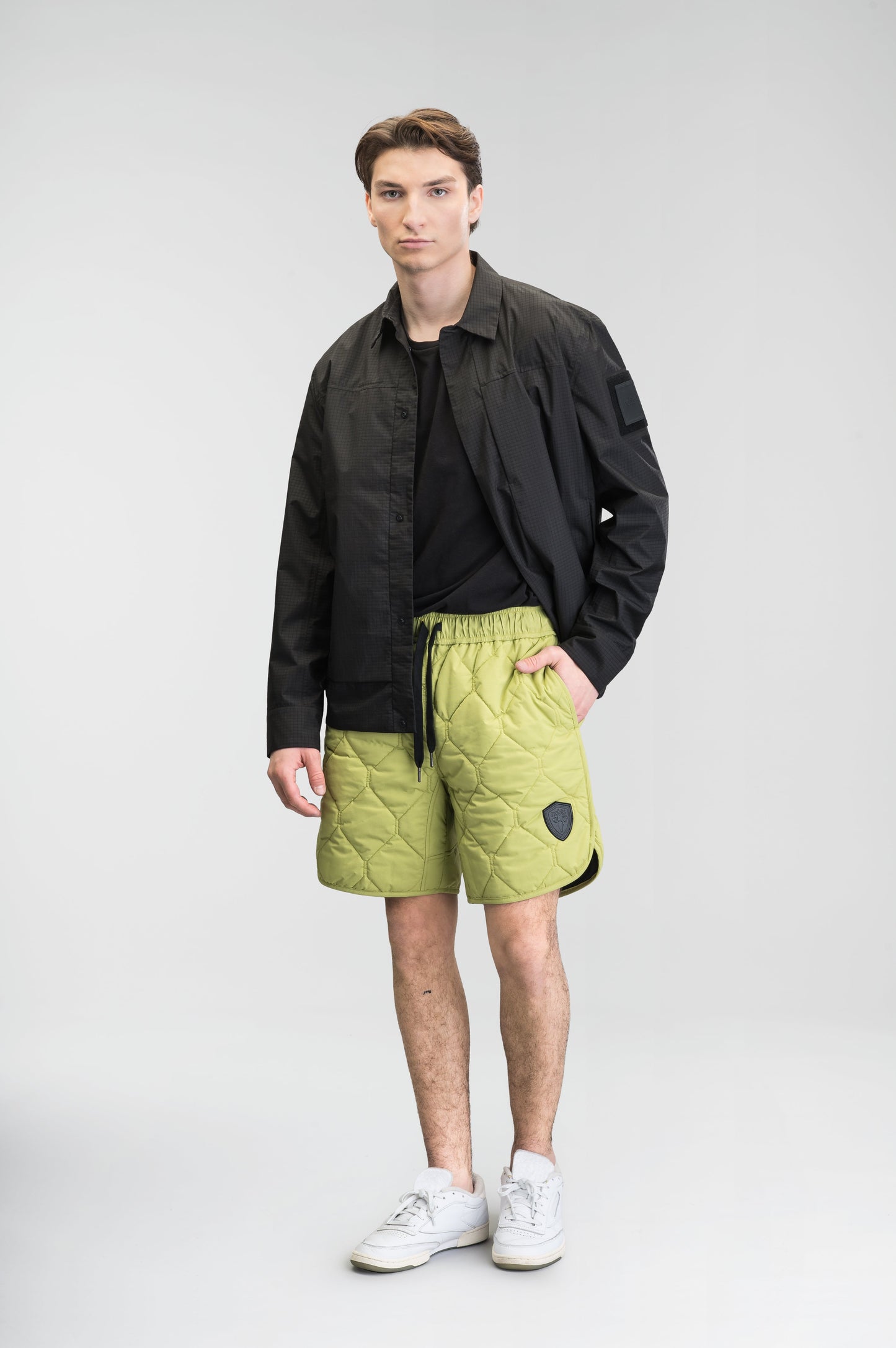 Curt Men's Performance Quilted Shorts at knee length, premium stretch nylon and stretch ripstop fabricaiton, premium 4-way stretch, water resistant Primaloft Gold Insulation Active+, side seam pockets, exteriror back pocket, elasticized waist with drawcords, and notch detailing at side seams, in Dark Citron