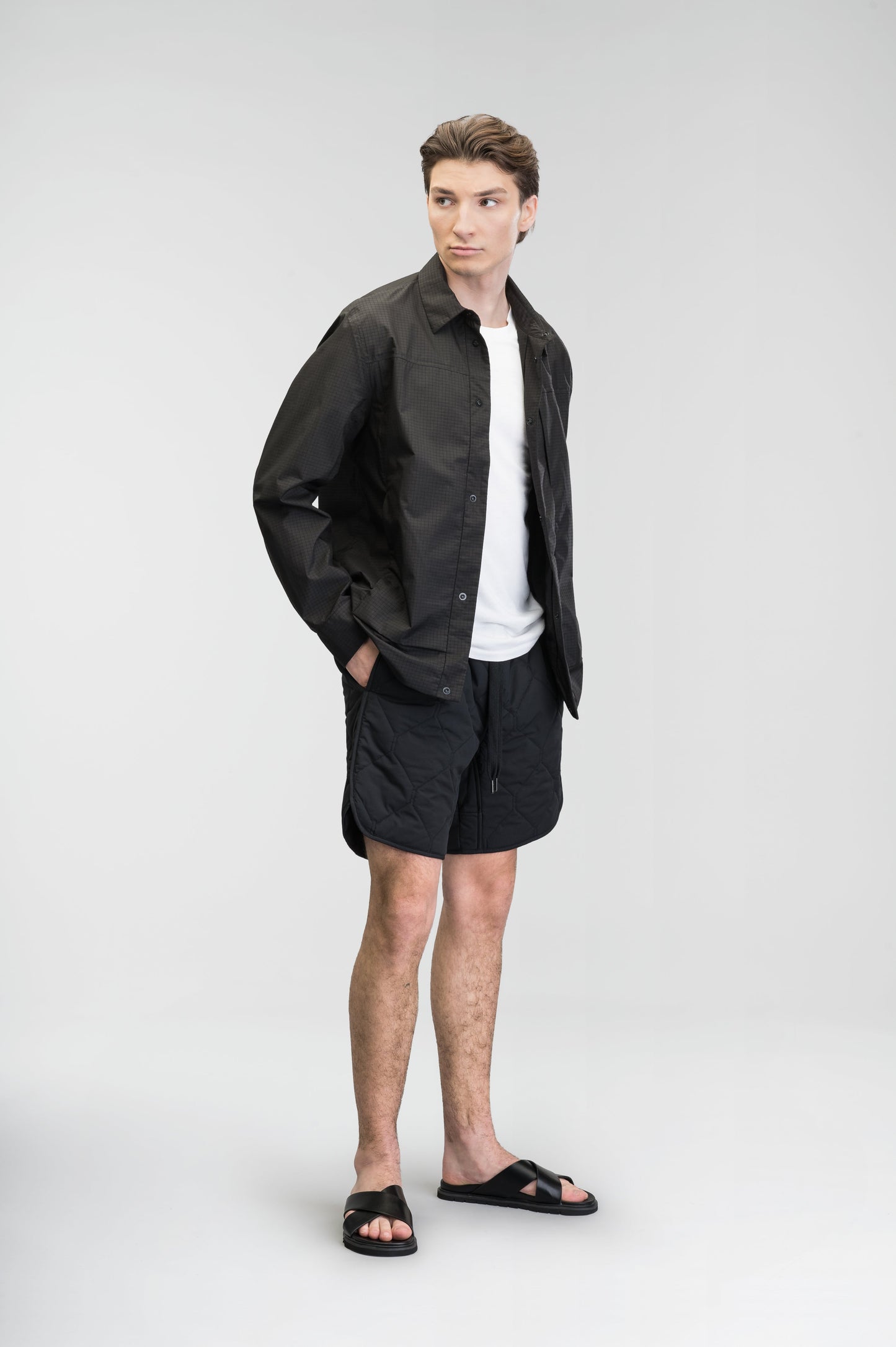 Curt Men's Performance Quilted Shorts at knee length, premium stretch nylon and stretch ripstop fabricaiton, premium 4-way stretch, water resistant Primaloft Gold Insulation Active+, side seam pockets, exteriror back pocket, elasticized waist with drawcords, and notch detailing at side seams, in Black