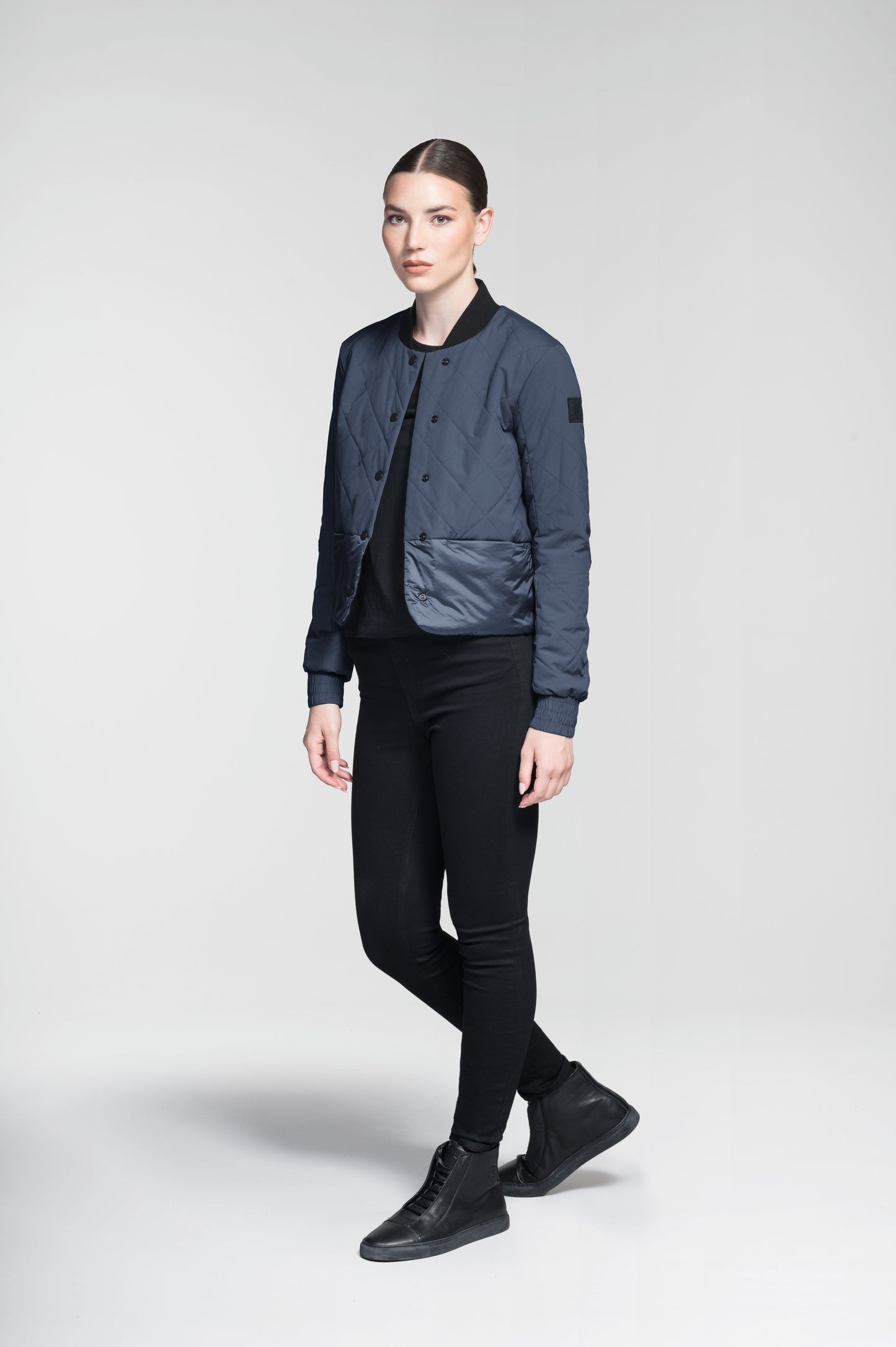 Lexi Women's Reversible Midlayer Jacket in waist length, premium stretch ripstop and contrast cire technical nylon taffeta fabrication, premium 4-way stretch, water resistant Primaloft Gold Insulation Active+, snap button closure at centre front, exterior magnetic closure pockets at sides, elasticized cuff details, and reversible from a quilted or smooth outer shell, in Marine