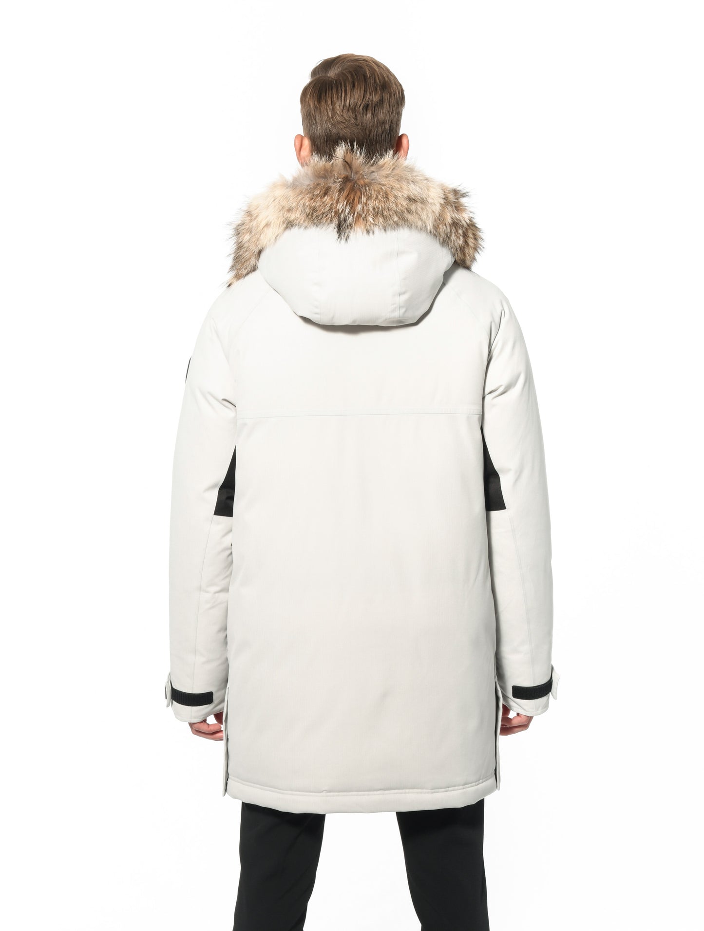 Men's thigh length down-filled parka with removable hood and removable coyote fur trim in Chalk