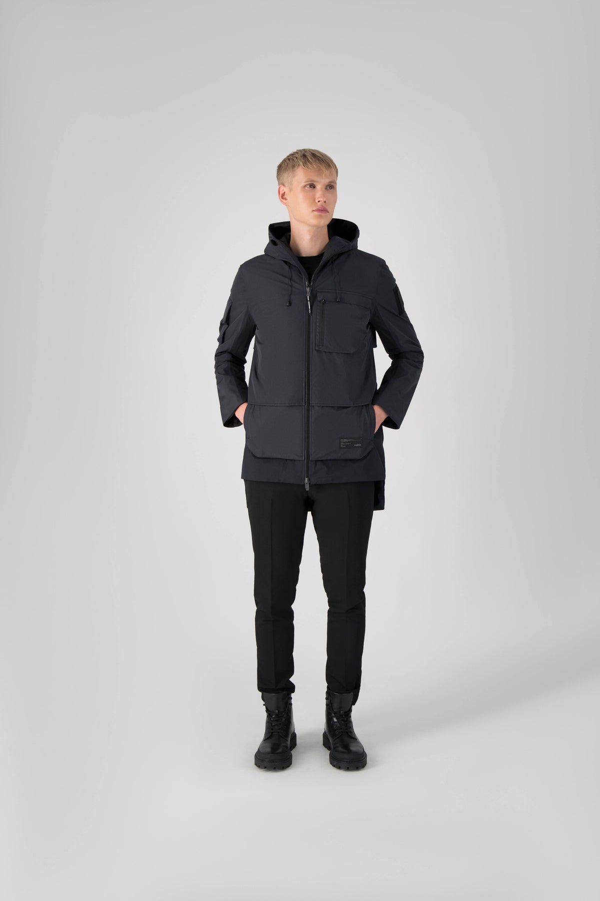 Alta Men's Performance Shell Jacket in hip length, Primaloft Gold Insulation Active+, chest and waist pockets, ventilation under arms, reflective detailing on hood and back, two-way front zipper, and non-removable hood with adjustable drawstrings, in Black