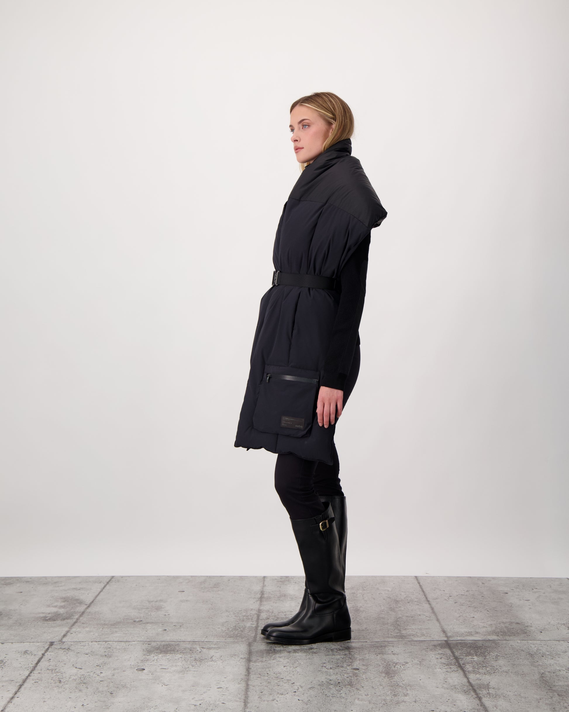 Chroma Unisex Oversized Puffer Scarf in stretch ripstop and taffeta nylon in a quilted pattern, Canadian White Duck Down insulation, cobra buckle belt with webbing strap, and large zipper pocket at scarf end, in Black