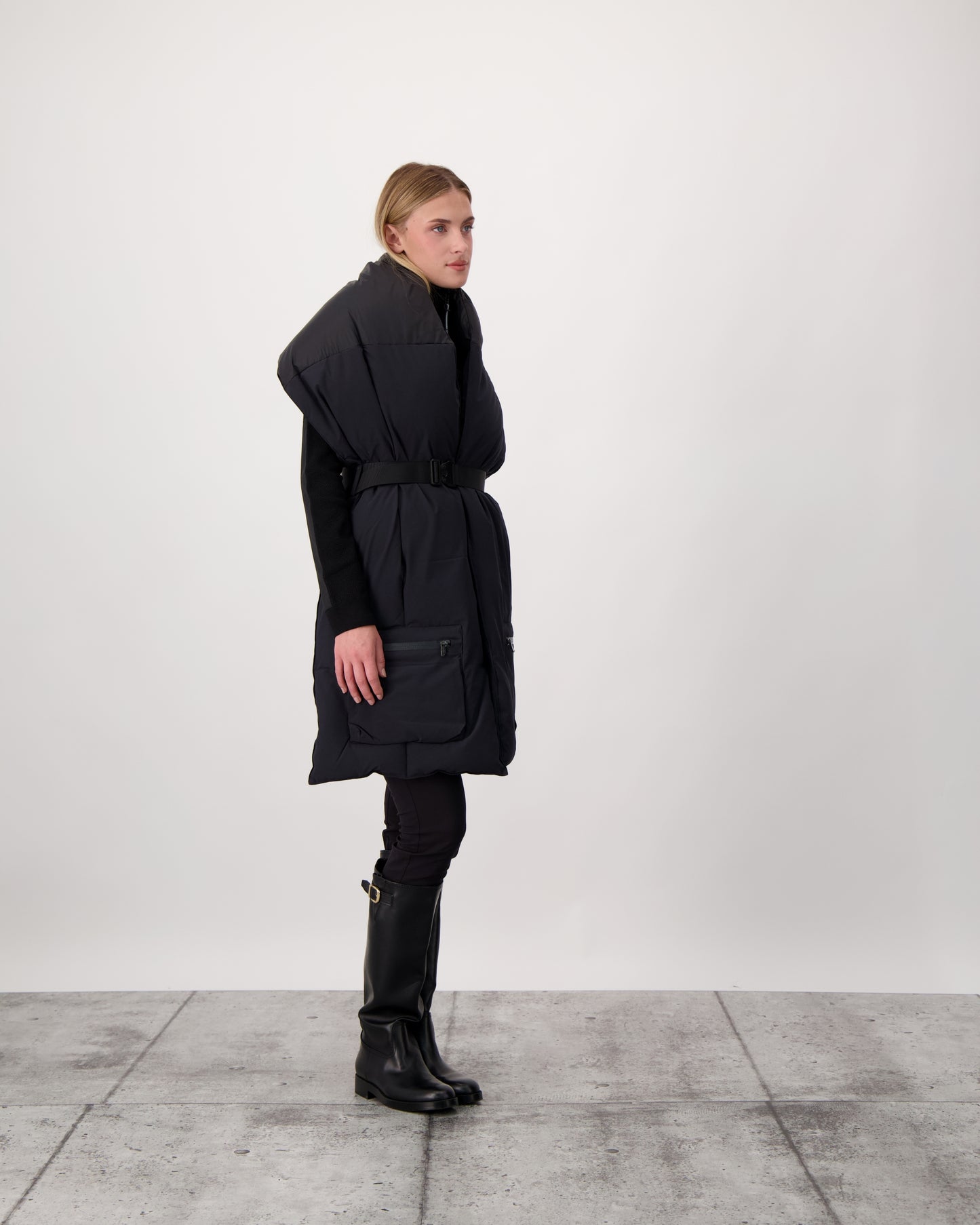 Chroma Unisex Oversized Puffer Scarf in stretch ripstop and taffeta nylon in a quilted pattern, Canadian White Duck Down insulation, cobra buckle belt with webbing strap, and large zipper pocket at scarf end, in Black