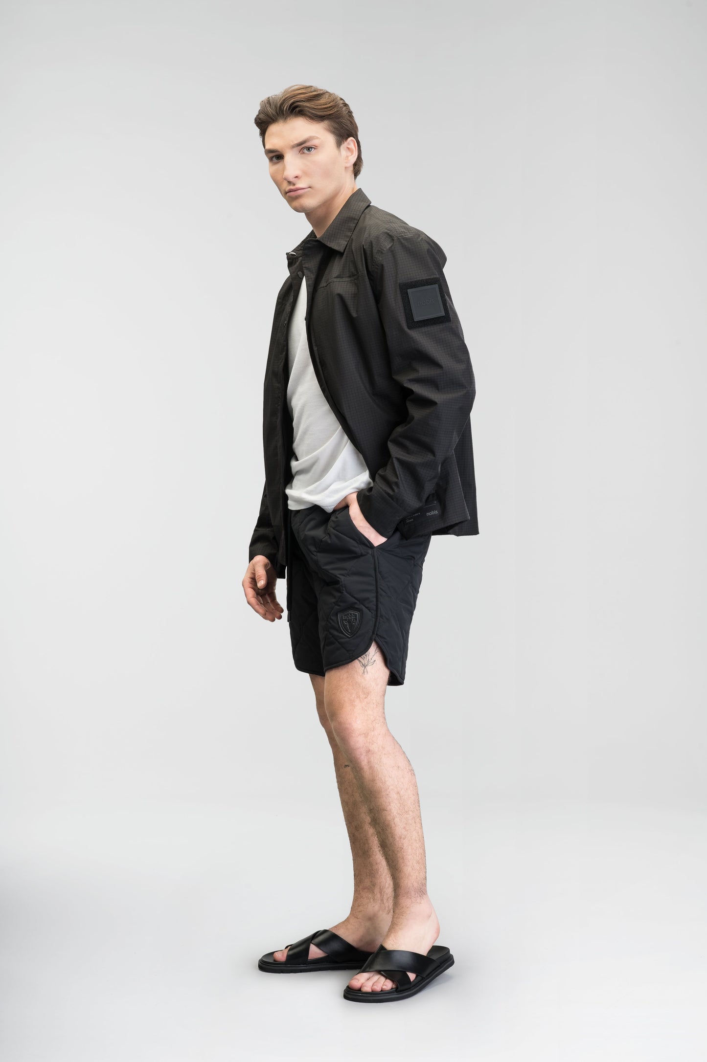 Curt Men's Performance Quilted Shorts at knee length, premium stretch nylon and stretch ripstop fabricaiton, premium 4-way stretch, water resistant Primaloft Gold Insulation Active+, side seam pockets, exteriror back pocket, elasticized waist with drawcords, and notch detailing at side seams, in Black