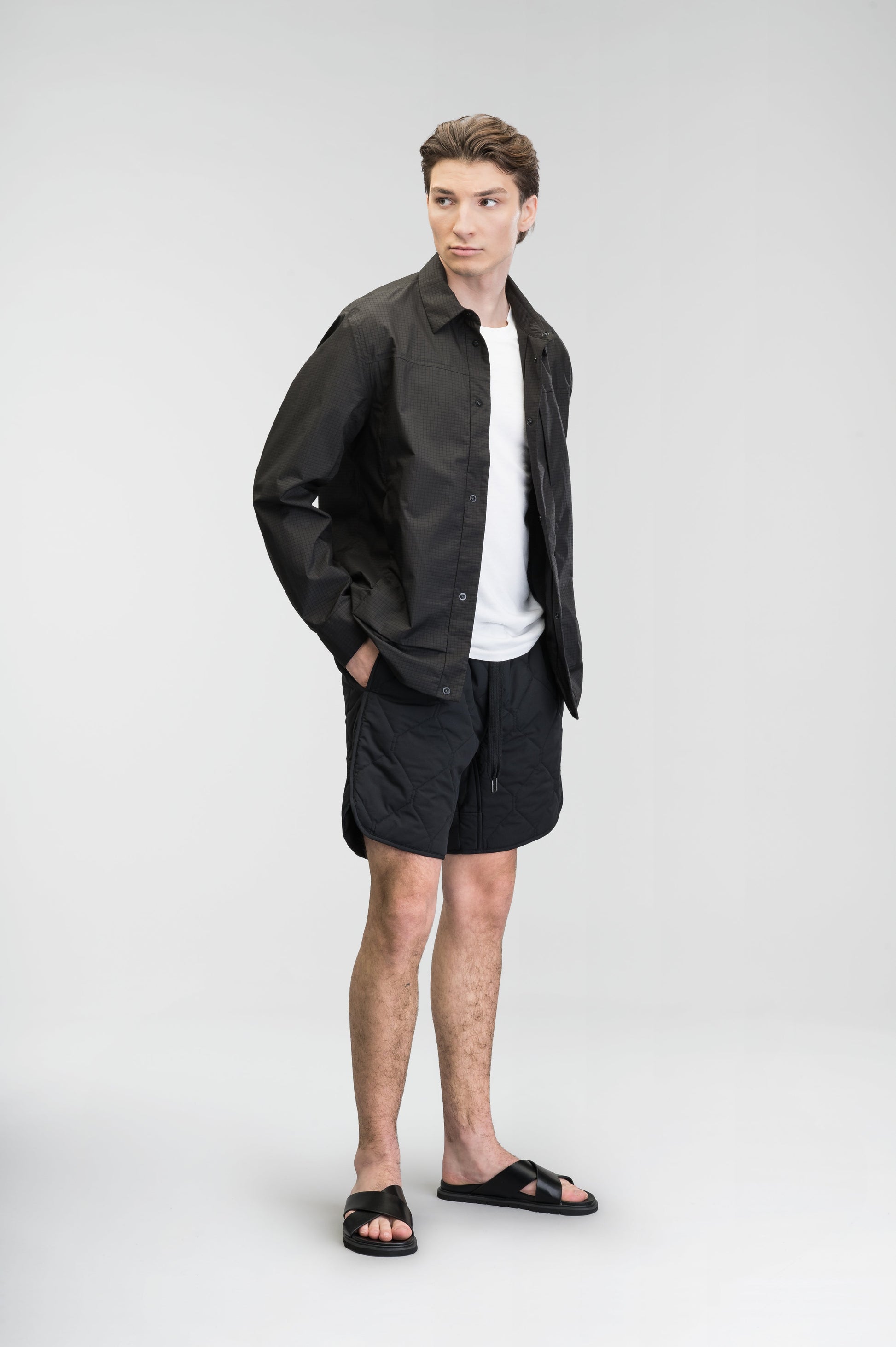 Curt Men's Performance Quilted Shorts at knee length, premium stretch nylon and stretch ripstop fabricaiton, premium 4-way stretch, water resistant Primaloft Gold Insulation Active+, side seam pockets, exteriror back pocket, elasticized waist with drawcords, and notch detailing at side seams, in Black