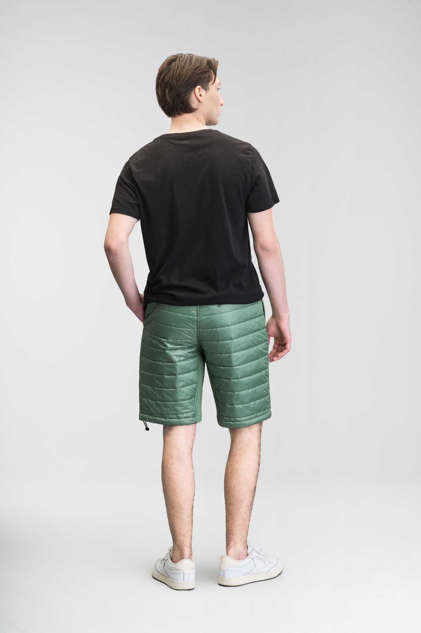 Decker Men's Performance Quilted Shorts in knee length, premium cire technical nylon taffeta and stretch nylon fabrication, premium 4-way stretch, water-resistant Primaloft Gold Insulation Active+, side seam pockets, invisible zipper back pokcet, elasticized waist with drawcords, and hidden drawcord at leg hems, in Comfrey