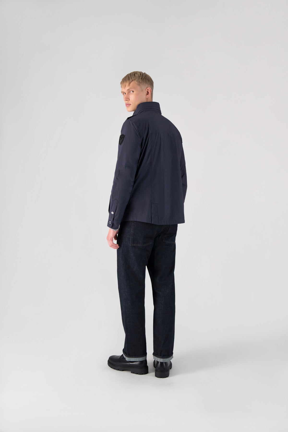Fisherman is a men’s lightweight waterproof jacket offering exceptional durability, crafted from matte technical taffeta with a breathable, seam-sealed construction for dependable weather protection in Marine