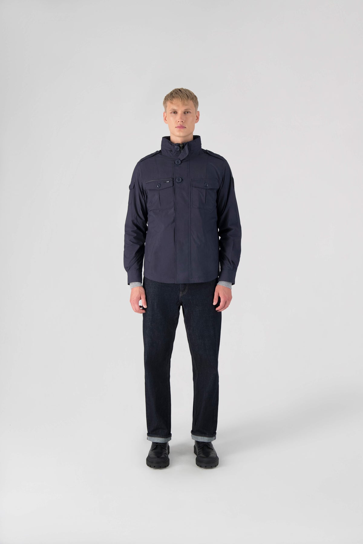 Fisherman is a men’s lightweight waterproof jacket offering exceptional durability, crafted from matte technical taffeta with a breathable, seam-sealed construction for dependable weather protection in Marine