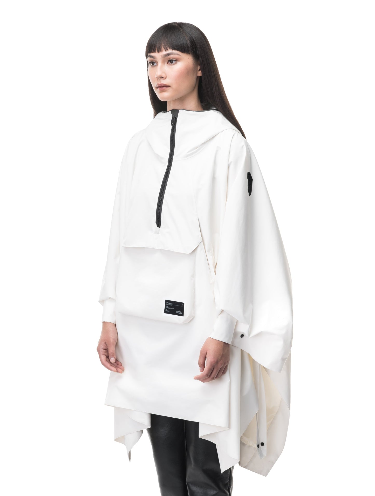 Hydra Unisex Performance Poncho in thigh length, non-removable hood, vertical half-zipper along centre front collar, hidden side-entry waist zipper pockets, adjustable webbing straps and snap closure cuffs, and packable to front kangaroo pocket with flap opening, in Chalk