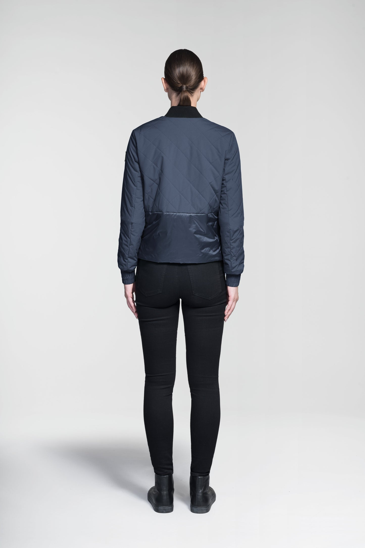 Lexi Women's Reversible Midlayer Jacket in waist length, premium stretch ripstop and contrast cire technical nylon taffeta fabrication, premium 4-way stretch, water resistant Primaloft Gold Insulation Active+, snap button closure at centre front, exterior magnetic closure pockets at sides, elasticized cuff details, and reversible from a quilted or smooth outer shell, in Marine