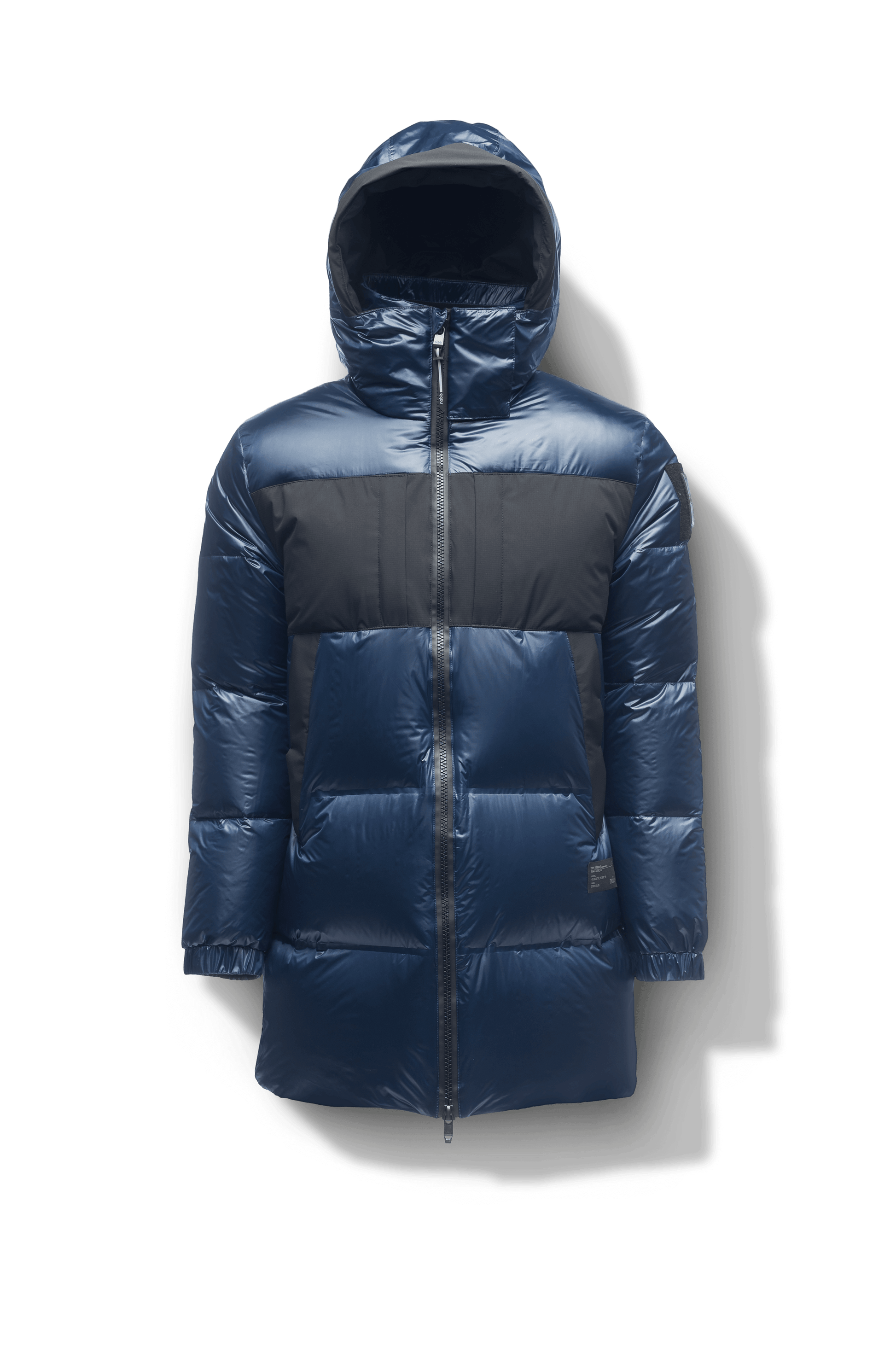 Neelix Men's Long Puffer Jacket in thigh length, premium cire technical nylon taffeta and stretch ripstop fabrication, Premium Canadian origin White Duck Down insulation, non-removable down-filled hood, two-way centre-front zipper, pit zipper vents, hidden chest zipper pockets, fleece-lined magnetic closure waist pockets, in Marine