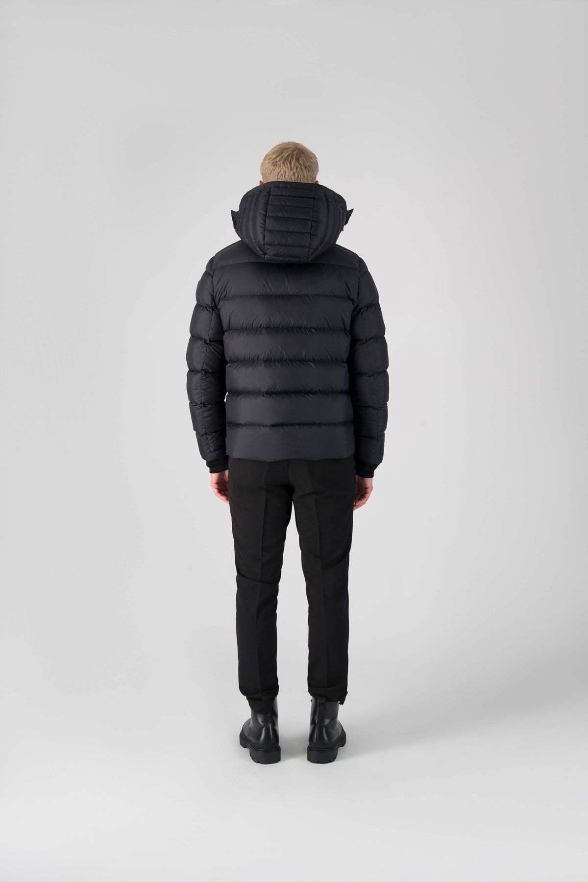 Hip length, reversible men's down filled jacket with removable hood in Black