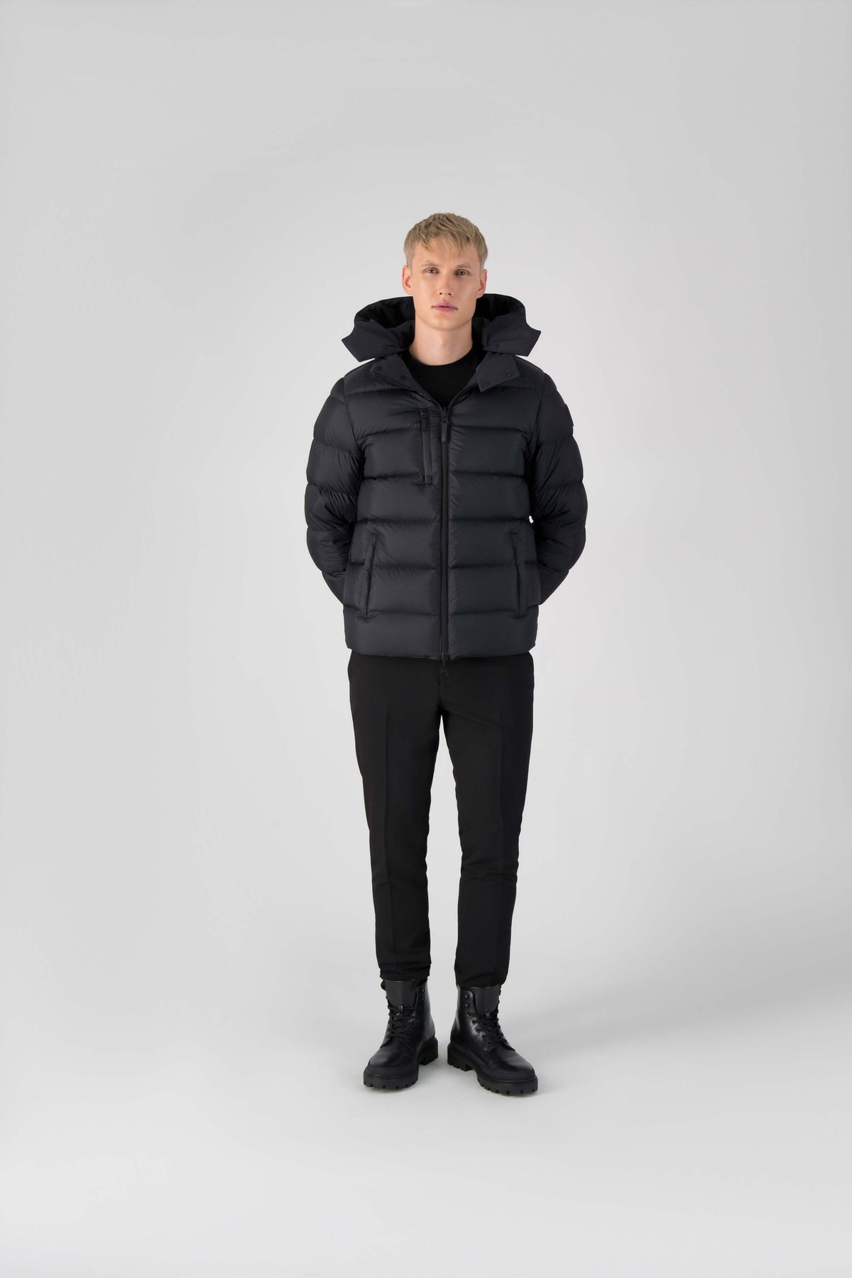 Hip length, reversible men's down filled jacket with removable hood in Black