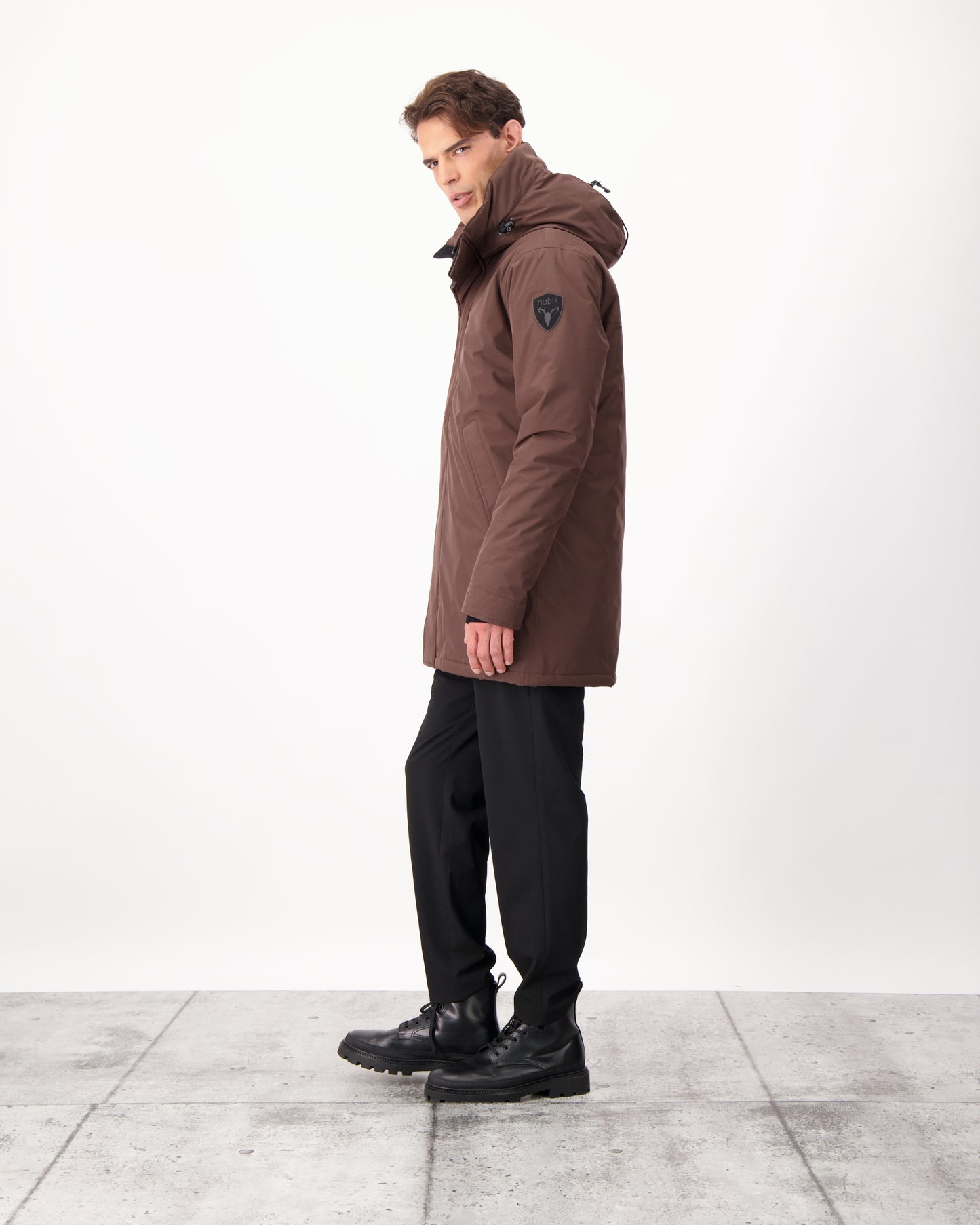 Pierre Men's Jacket in thigh length, Canadian white duck down insulation, non-removable down-filled hood, angled waist pockets, centre-front zipper with wind flap, and elastic ribbed cuffs, in 3L Coffee Bean