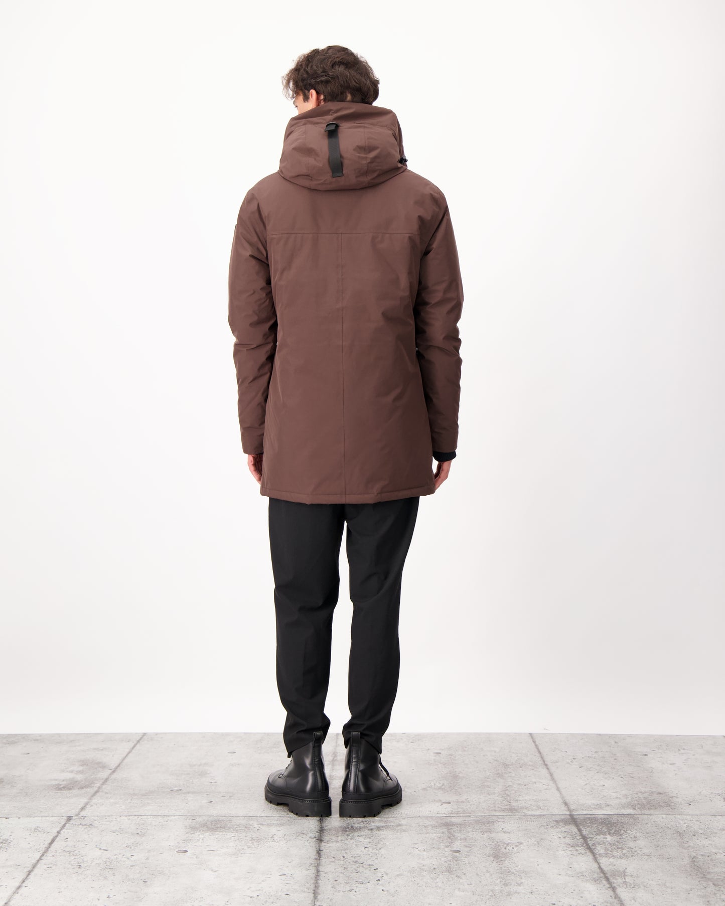 Pierre Men's Jacket in thigh length, Canadian white duck down insulation, non-removable down-filled hood, angled waist pockets, centre-front zipper with wind flap, and elastic ribbed cuffs, in 3L Coffee Bean
