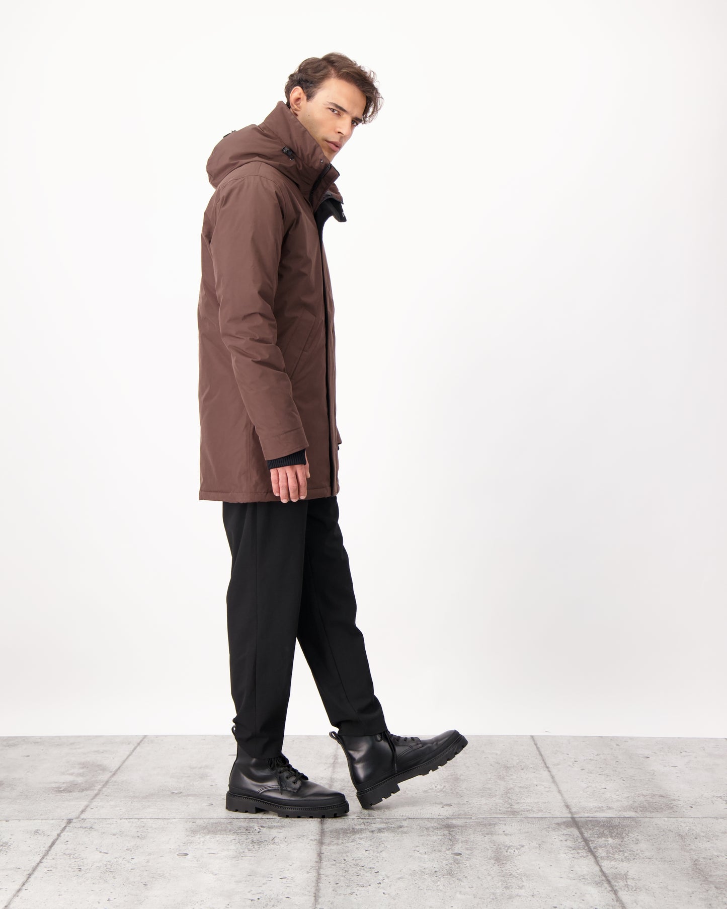 Pierre Men's Jacket in thigh length, Canadian white duck down insulation, non-removable down-filled hood, angled waist pockets, centre-front zipper with wind flap, and elastic ribbed cuffs, in 3L Coffee Bean