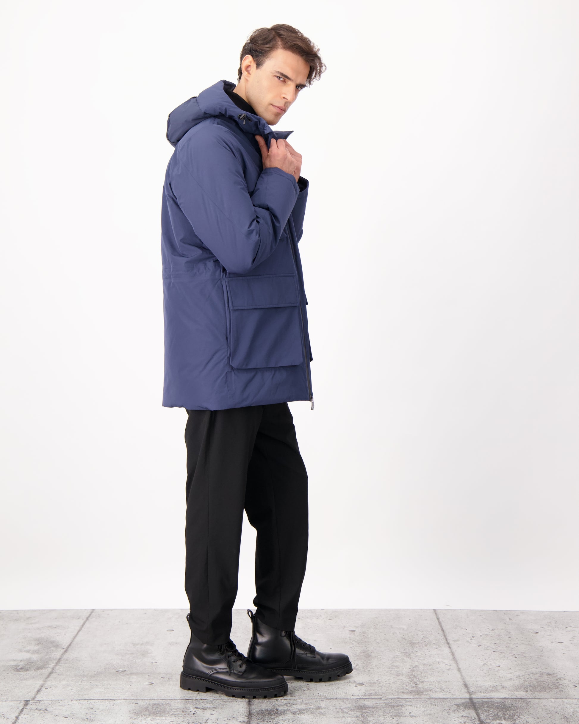 Ronin Men's Performance Utility Jacket in thigh length, premium 3-ply micro denier and stretch ripstop fabrication, Premium Canadian origin White Duck Down insulation, non-removable down-filled hood, bellow chest pockets, magnetic closure waist flap pockets, two-way centre-front zipper, pit zipper vents, hidden adjustable waist drawcord, in Marine