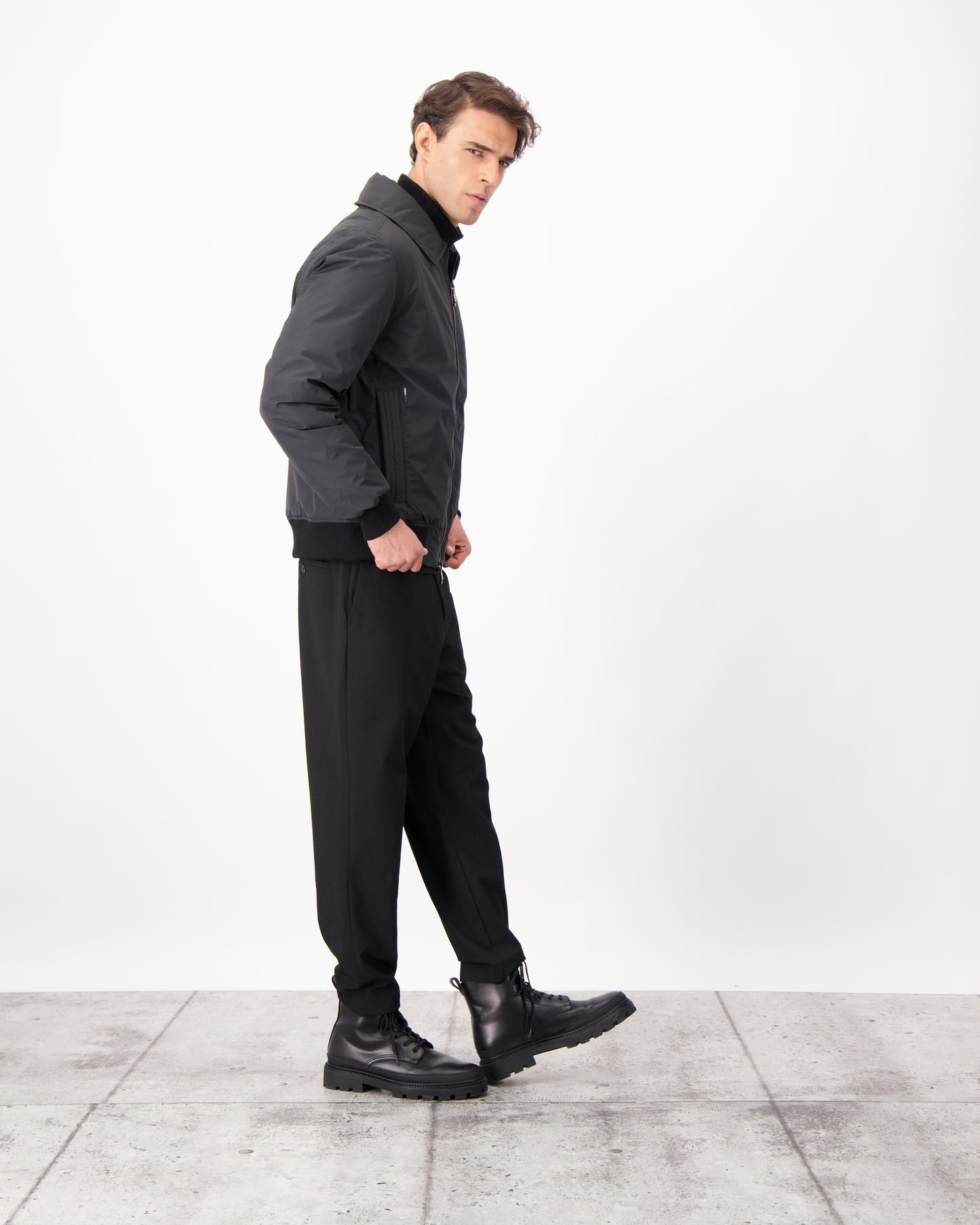 Sonar Men's Aviator Jacket in hip length, Canadian duck down insulation, removable shearling collar with hidden tuckable hood, and two-way front zipper, in Black
