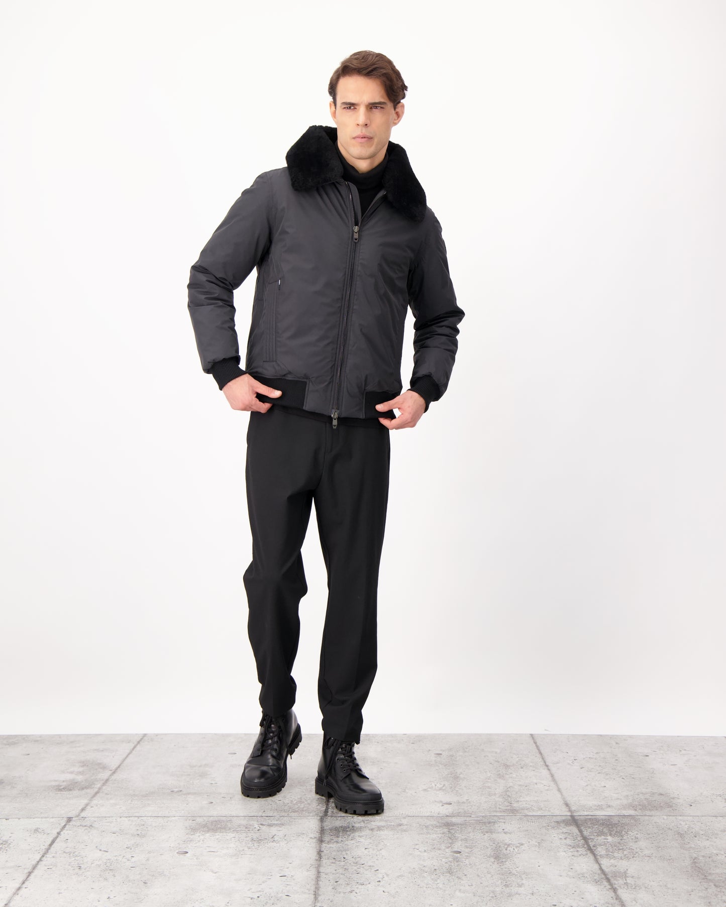 Sonar Men's Aviator Jacket in hip length, Canadian duck down insulation, removable shearling collar with hidden tuckable hood, and two-way front zipper, in Black