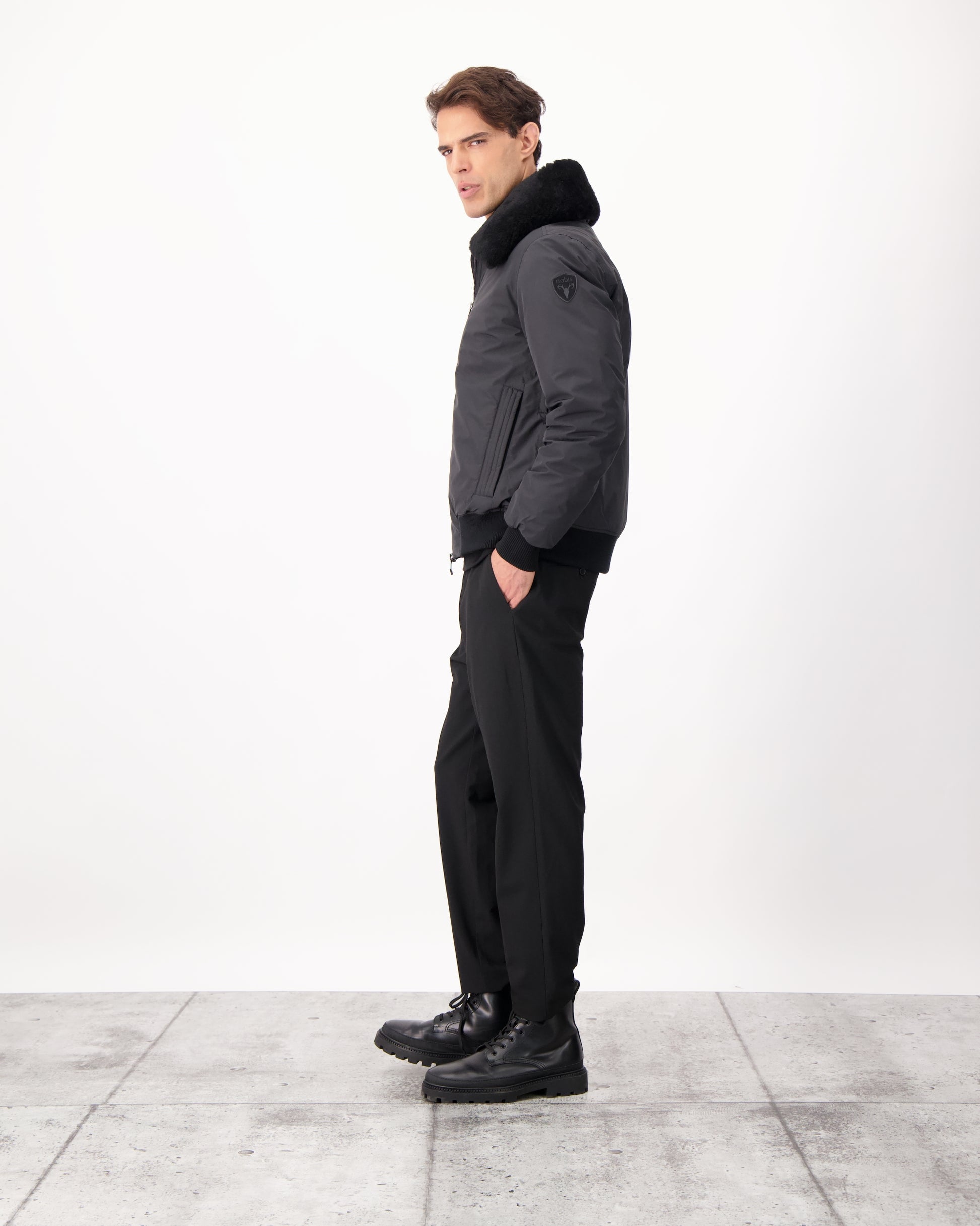 Sonar Men's Aviator Jacket in hip length, Canadian duck down insulation, removable shearling collar with hidden tuckable hood, and two-way front zipper, in Black