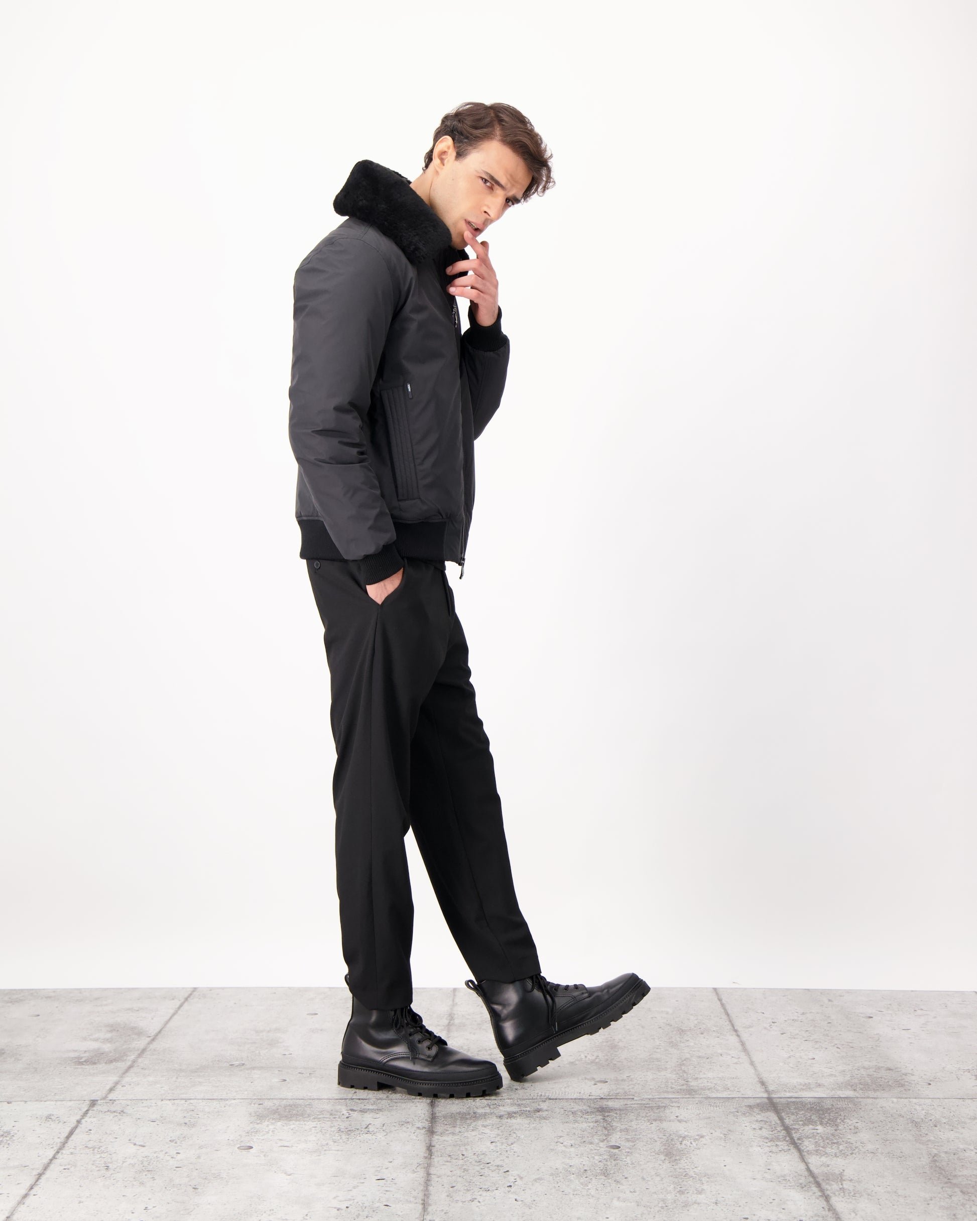 Sonar Men's Aviator Jacket in hip length, Canadian duck down insulation, removable shearling collar with hidden tuckable hood, and two-way front zipper, in Black