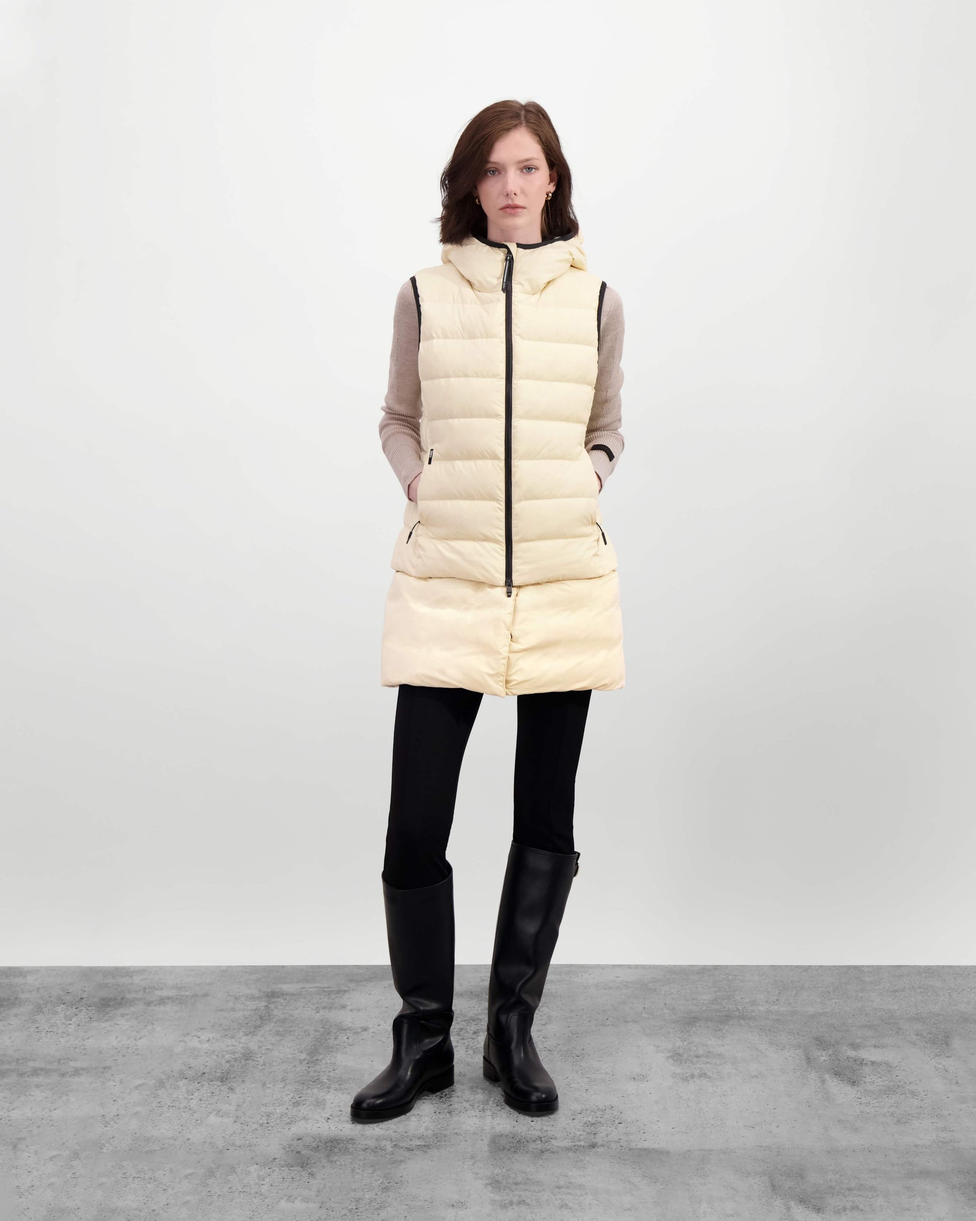 Saratoga puffer vest in Wheat insulated with Canadian white duck down, featuring stretch nylon ribbing for mobility, hidden waist drawcord, and a tailored fit for warmth and style. Lightweight and ideal for layering.