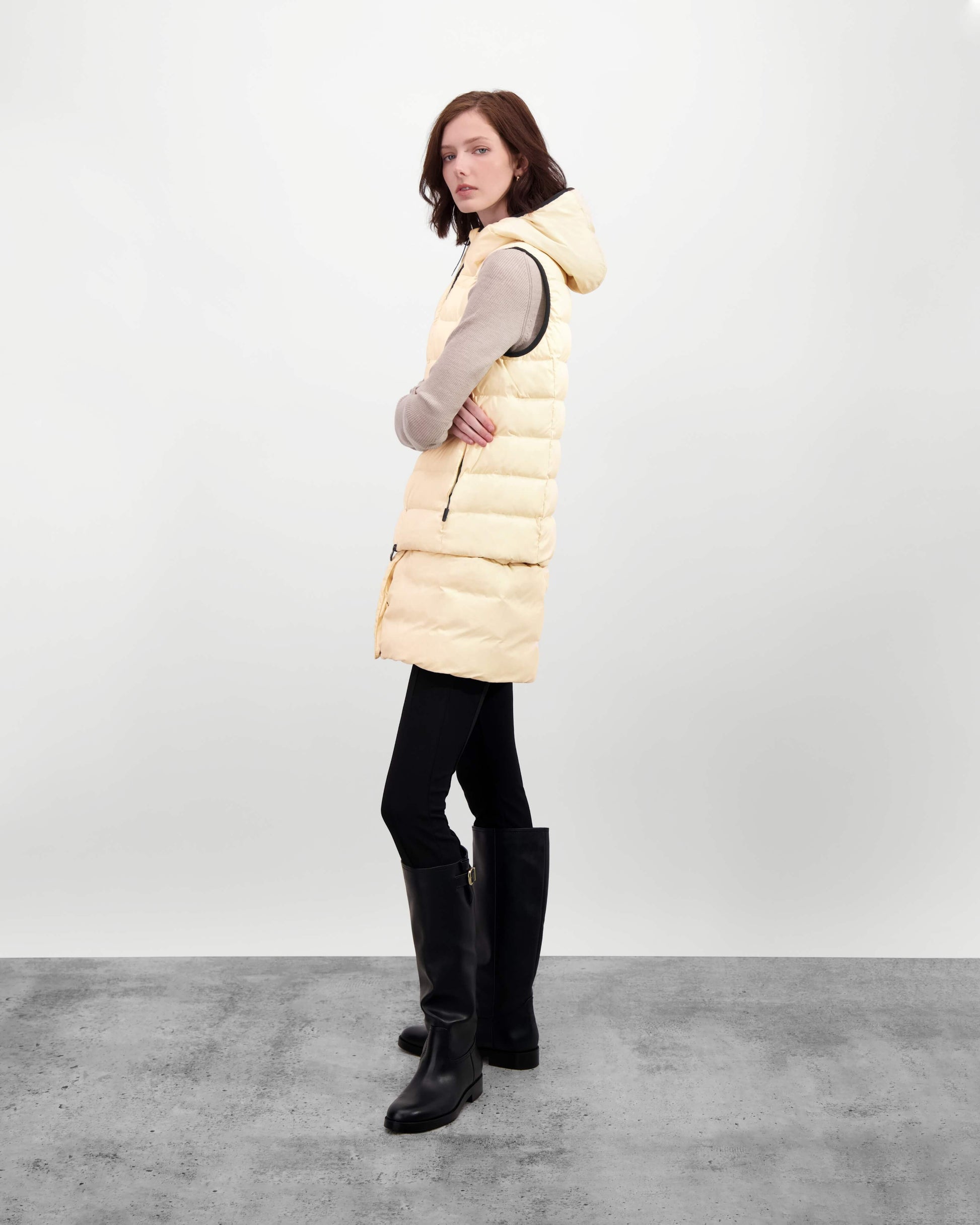 Saratoga puffer vest in Wheat insulated with Canadian white duck down, featuring stretch nylon ribbing for mobility, hidden waist drawcord, and a tailored fit for warmth and style. Lightweight and ideal for layering.