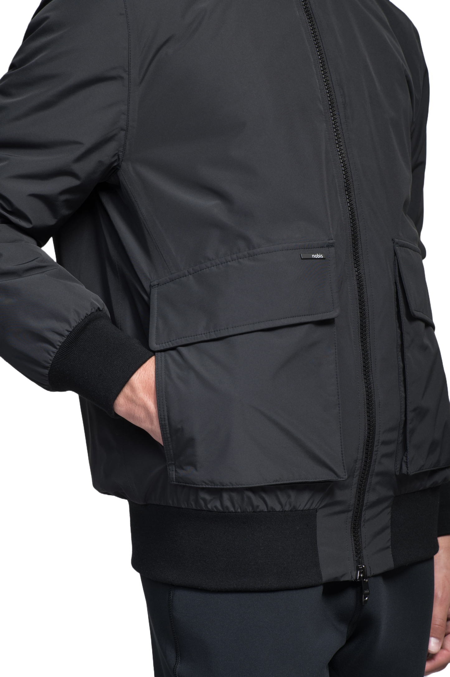 Flint Men's Tailored Rib Collar Jacket in hip length, premium 3-ply Micro Denier fabrication, premium 4-way stretch, water resistant Primaloft Gold Insulation Active +, flap pockets with magnetic closure at waist, side entry pockets at waist, ribbed sleeve cuffs, two-way branded zipper at centre front, box pleat detailing at centre back, large interior zipper pocket, and interior button pocket at left chest, in Black