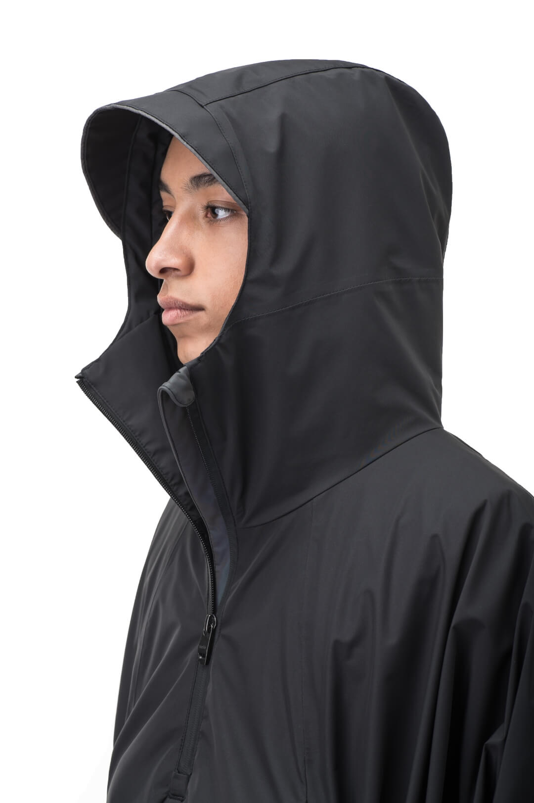 Hydra Unisex Performance Poncho in thigh length, non-removable hood, vertical half-zipper along centre front collar, hidden side-entry waist zipper pockets, adjustable webbing straps and snap closure cuffs, and packable to front kangaroo pocket with flap opening, in Black