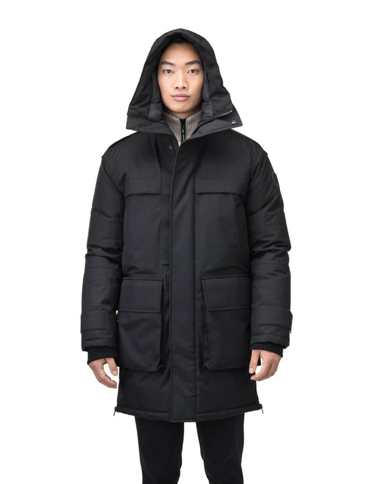 Alum Men's Long Parka in thigh length, Premium Canadian White Duck Down insulation, non-removable hood with removable coyote fur trim, two-way centre front zipper with magnetic closure wind flap, four exterior patch pockets at front, in Black