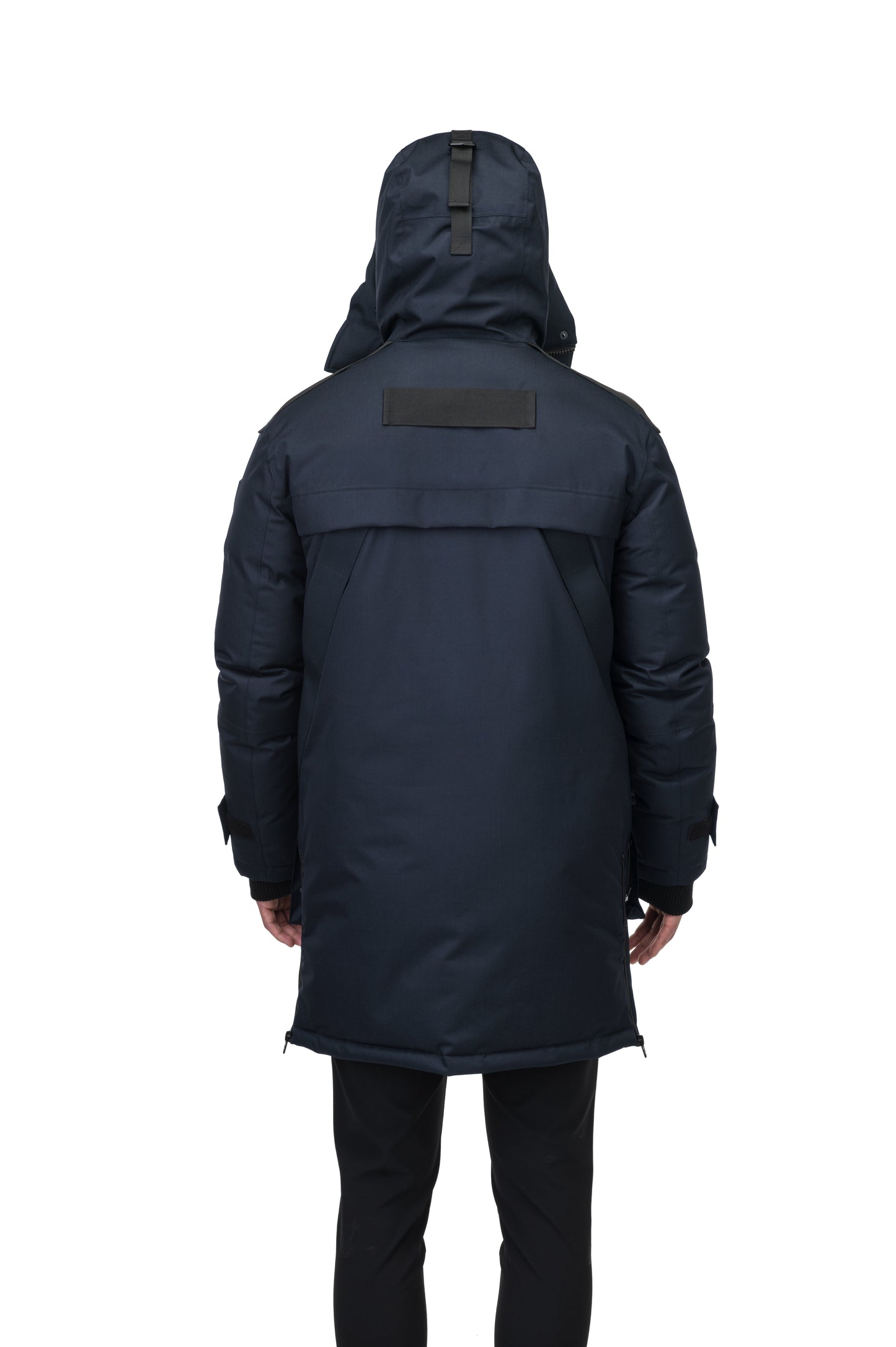 Alum Men's Long Parka in thigh length, Premium Canadian White Duck Down insulation, non-removable hood with removable coyote fur trim, two-way centre front zipper with magnetic closure wind flap, four exterior patch pockets at front, in Navy