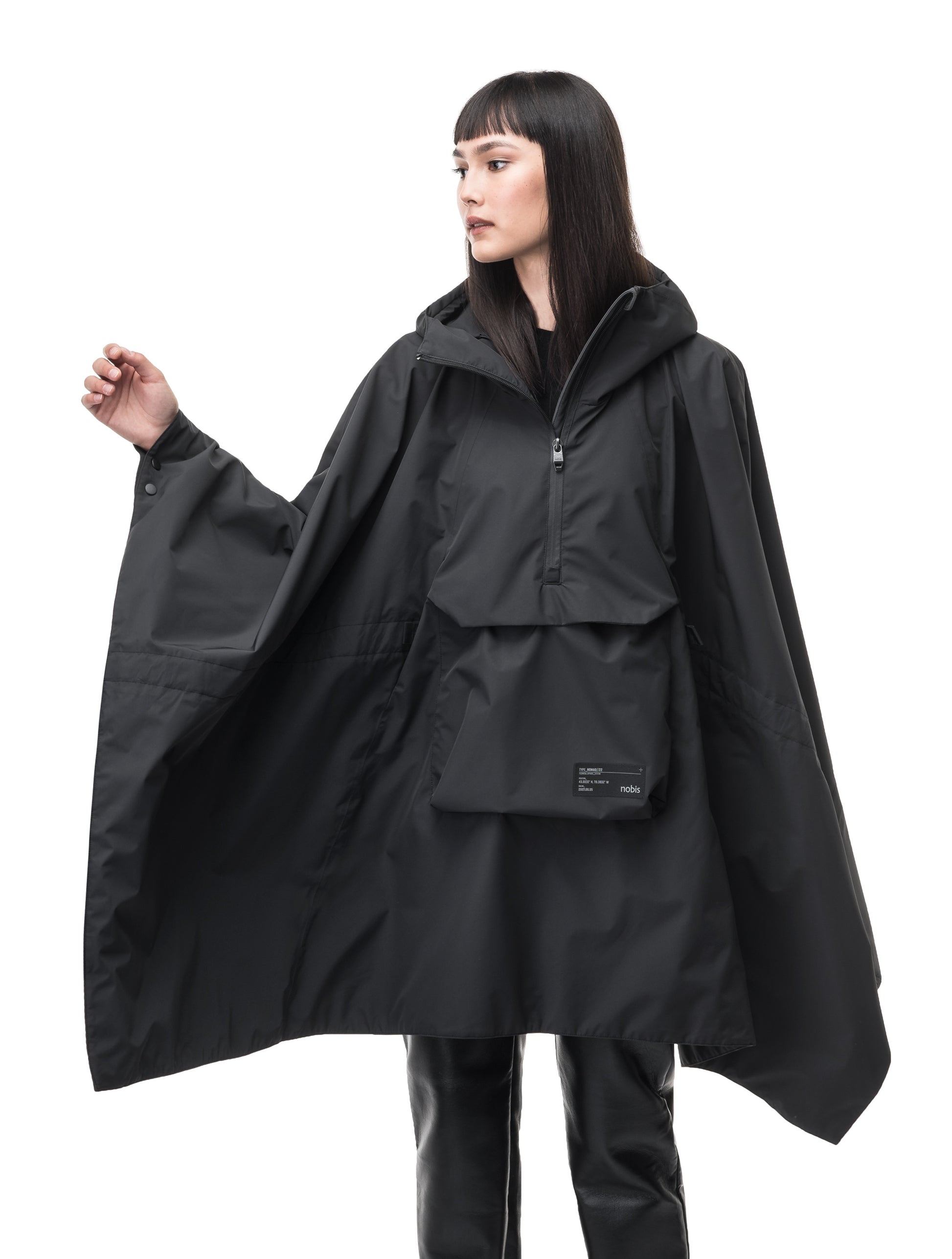 Hydra Unisex Performance Poncho in thigh length, non-removable hood, vertical half-zipper along centre front collar, hidden side-entry waist zipper pockets, adjustable webbing straps and snap closure cuffs, and packable to front kangaroo pocket with flap opening, in Black