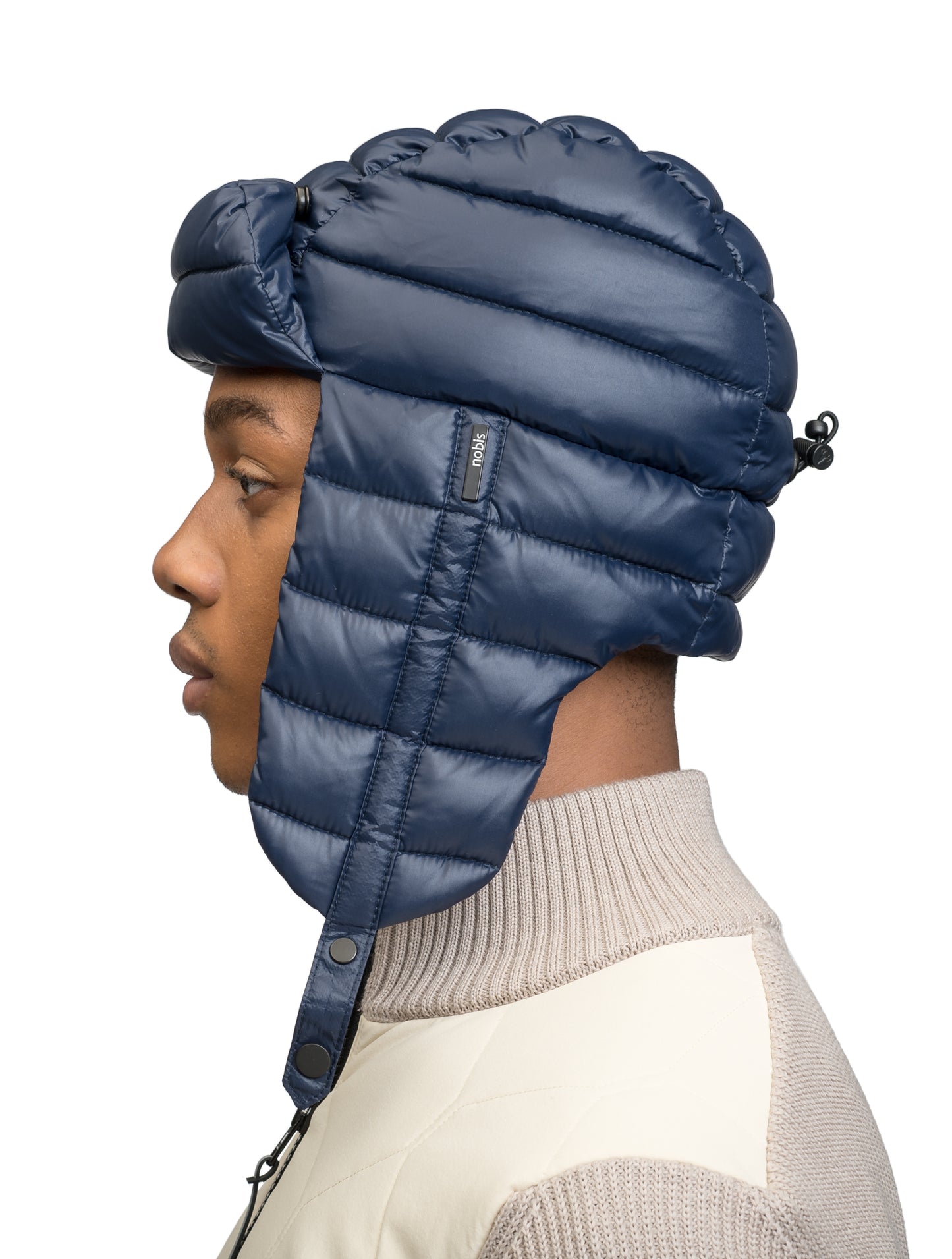 Unisex down-filled quilted fargo hat with adjustable chin strap in Marine