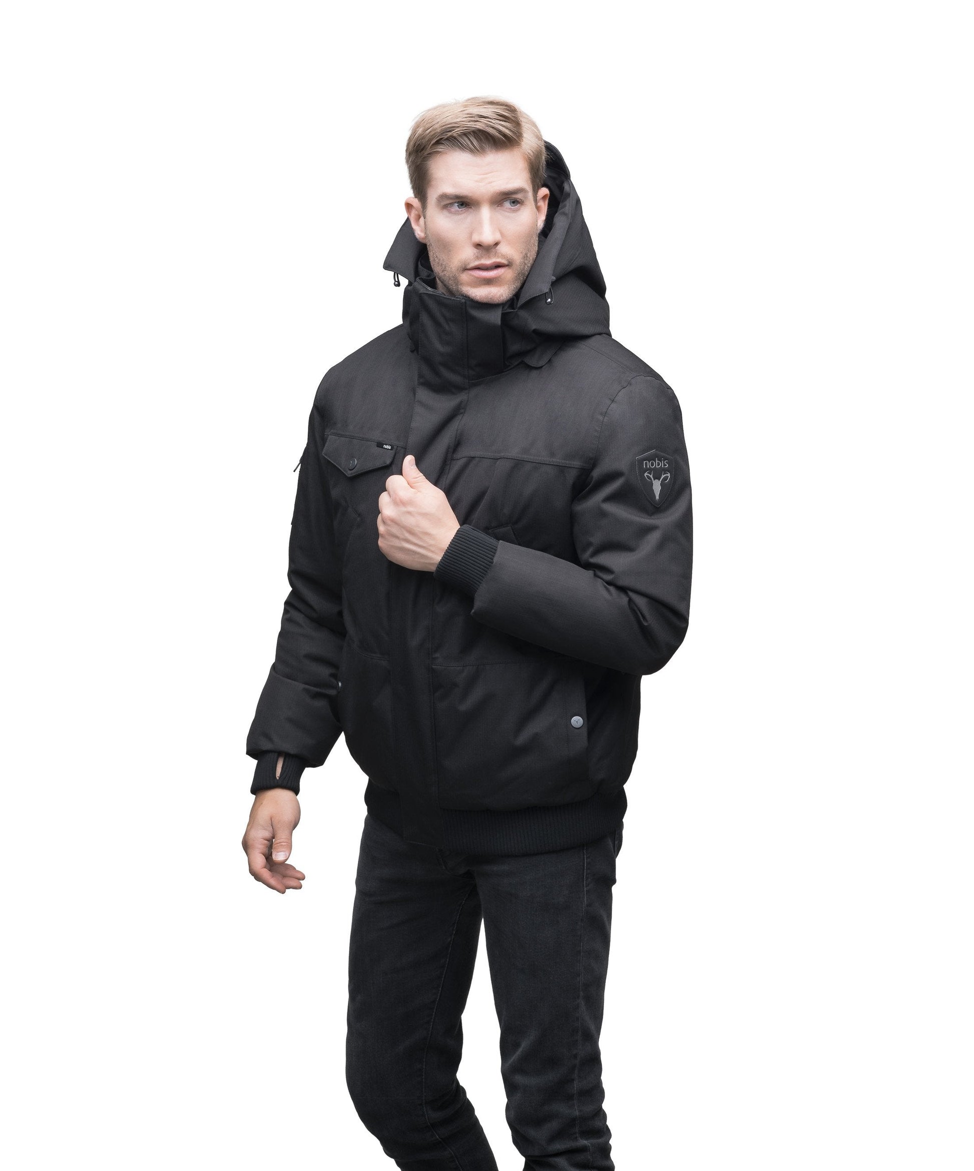 Men's sleek down filled bomber jacket with clean details and a fur free hood in CH Black